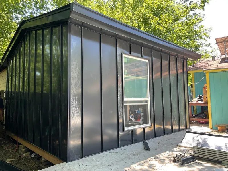 Black standing seam metal wall panels for Roof Inspection in Sandy Oaks